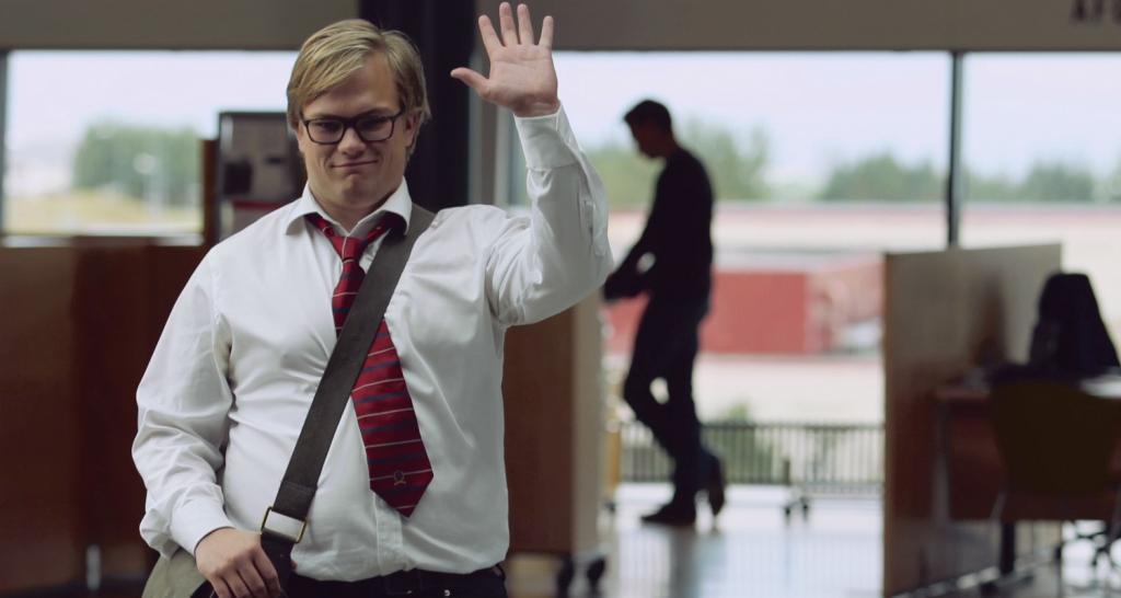 A man waving and being friendly. Just because people act friendly doesn't mean they are friends or should be trusted with sensitive information. Social engineering is on of the cyber security awareness topics your employees need to know about. 