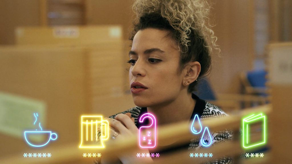 A woman strings together words to create a strong password. Strong passwords are a cyber security awareness topic your employees need to know about. 