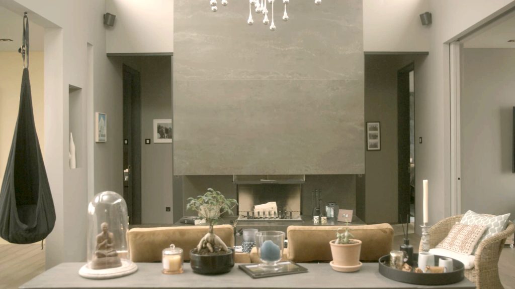 Inside a smart home living room. Connected speakers near the ceiling could be used for botnet cyber attacks