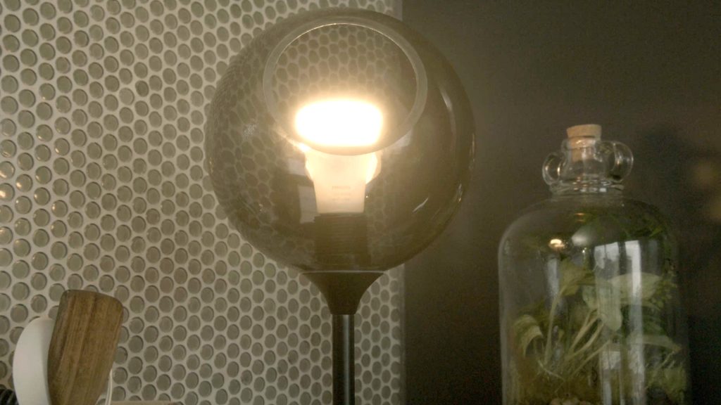 Smart home device lightbulb shining inside a home. This device could be used in a cyber attack.